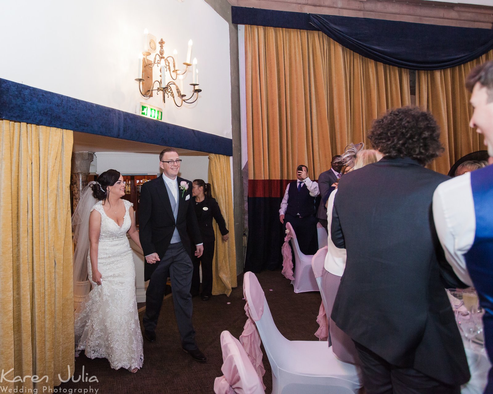 bride and groom arrive at their wedding breakfast in the Tilden suite