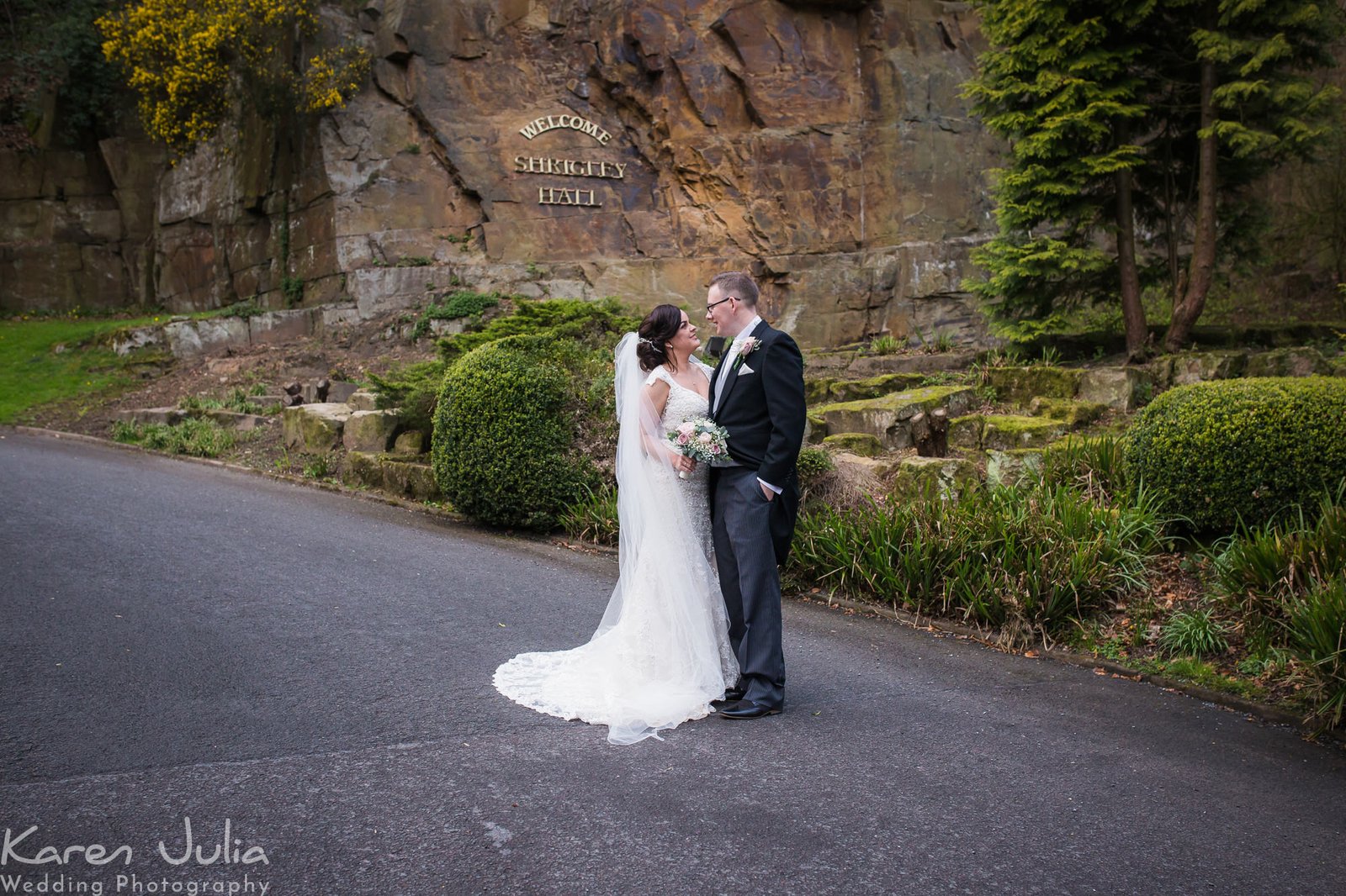 bride and groom portrait at the entrance to Shrigley Hall