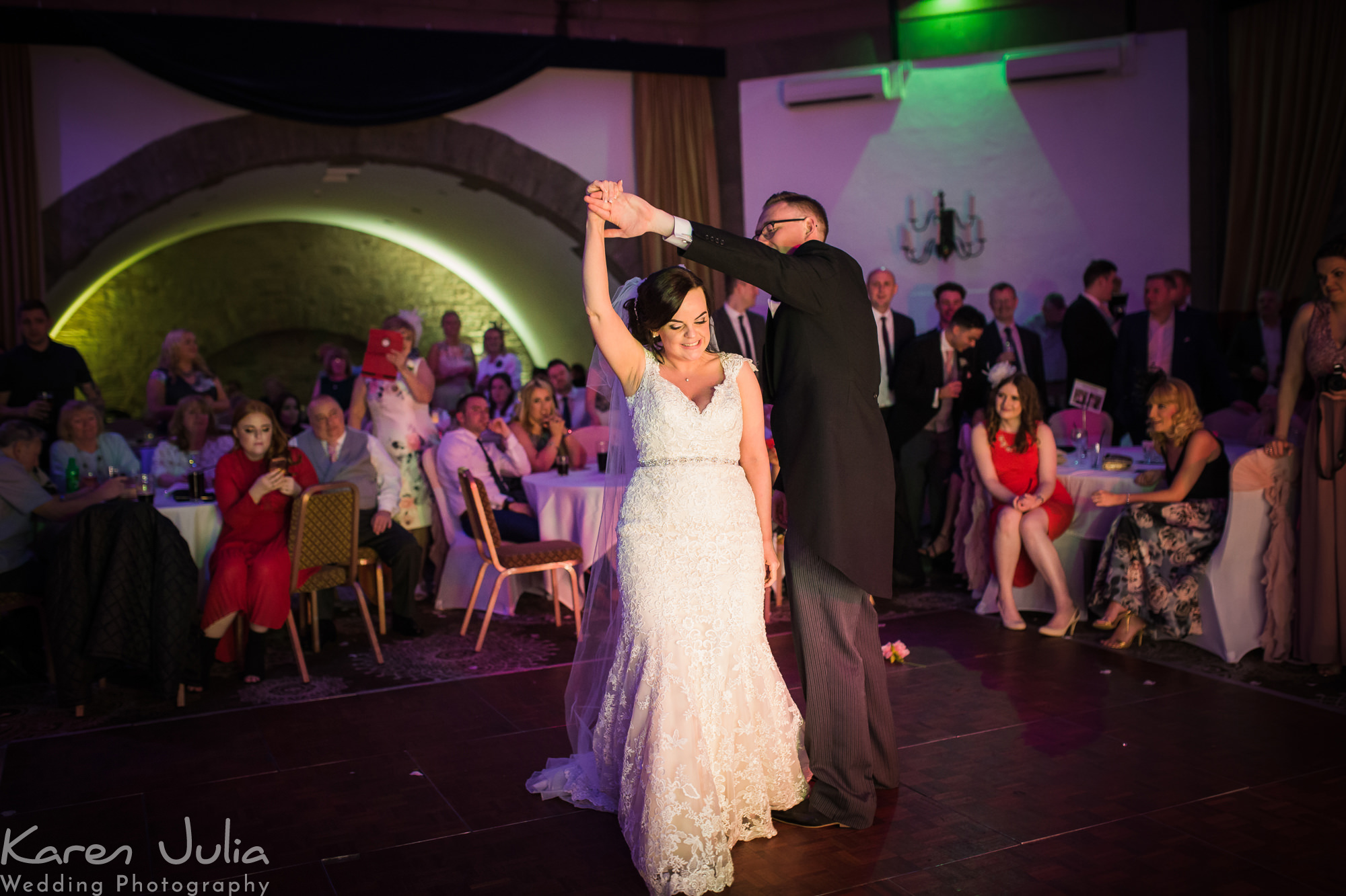 bride and groom have their first dance in the Tilden suite in Shrigley Hall