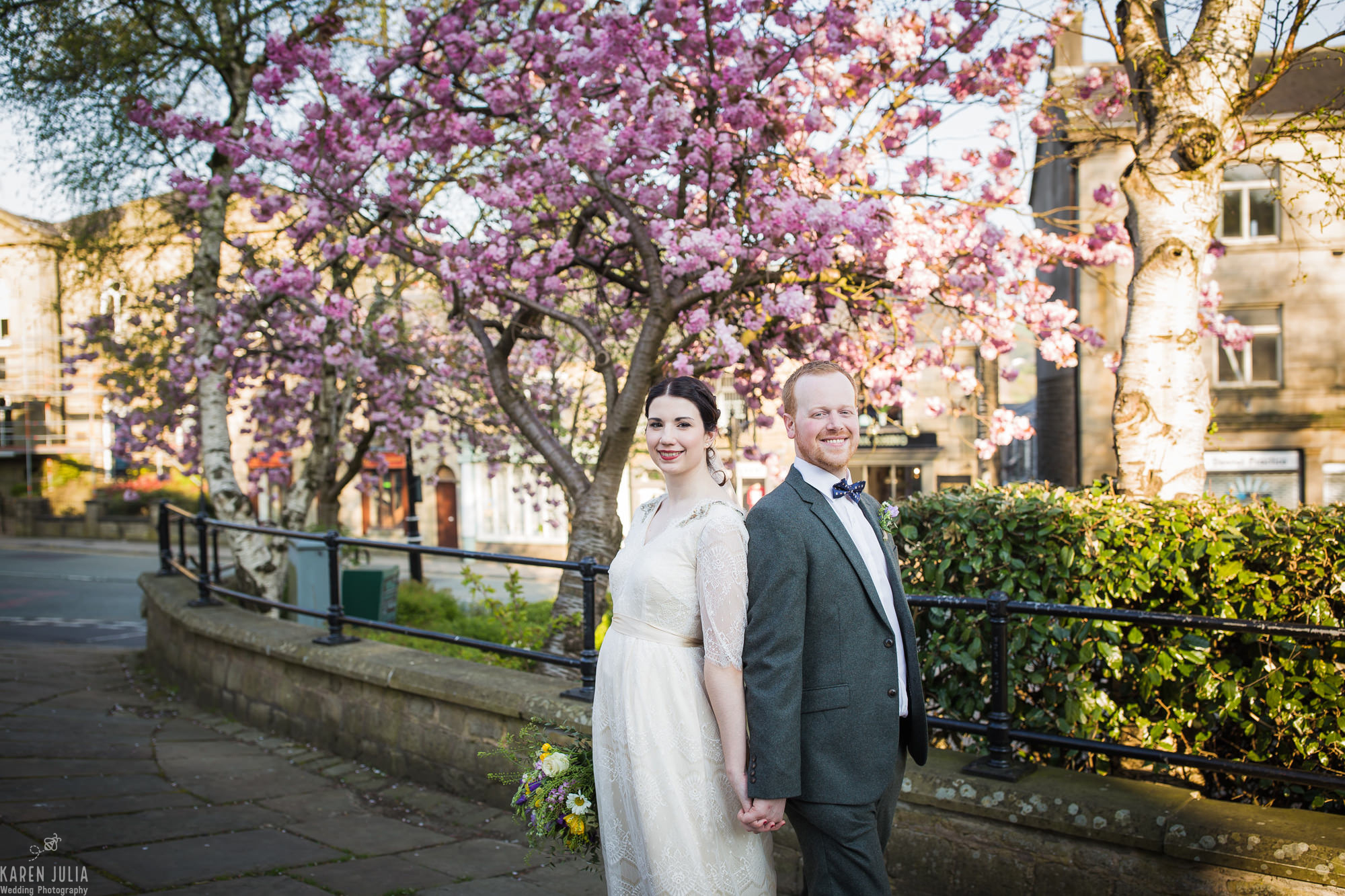 bride and groom portrait with cherry blossom backdrop