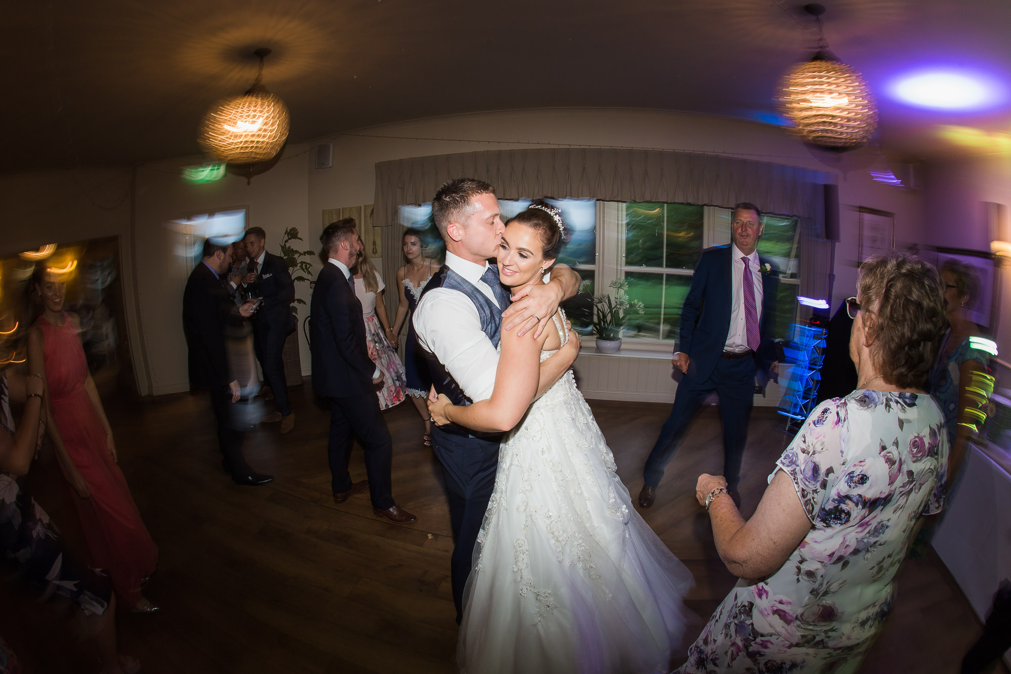 bride and groom embrace on dance floor at their Rustic Shireburn Arms Wedding