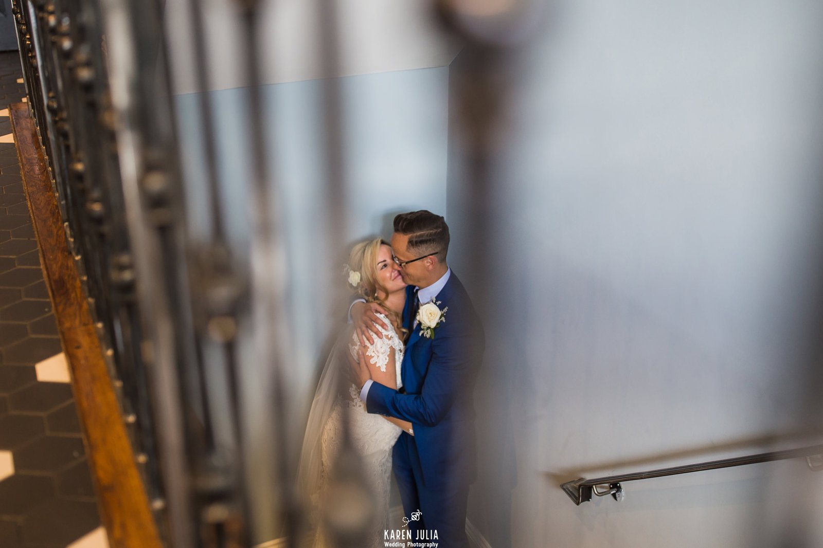 bride and groom embrace on the stairs to the roof terrace at King Street Townhouse Hotel