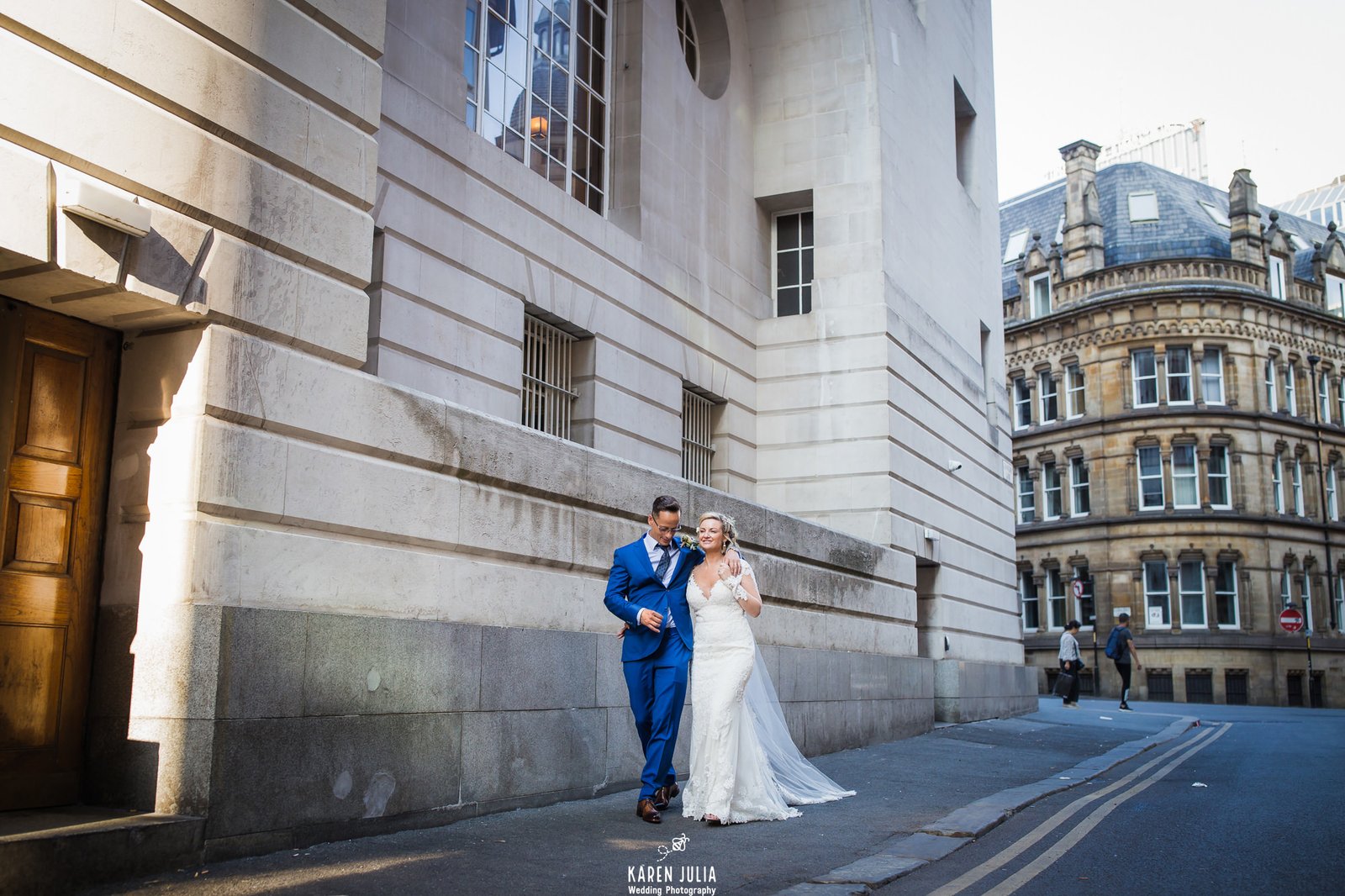 bride and groom walk together near King Street Townhouse