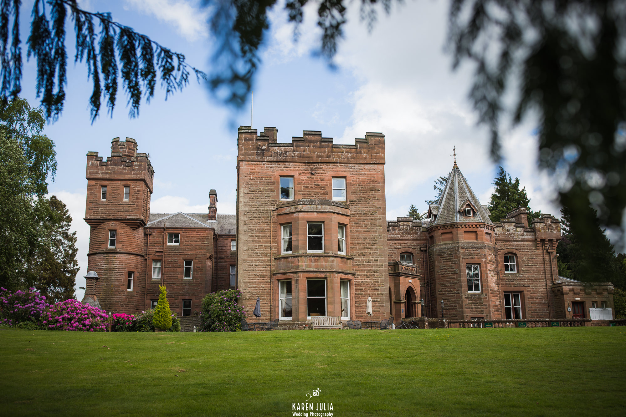 Friars Carse Country House front view with gardens in foreground in spring