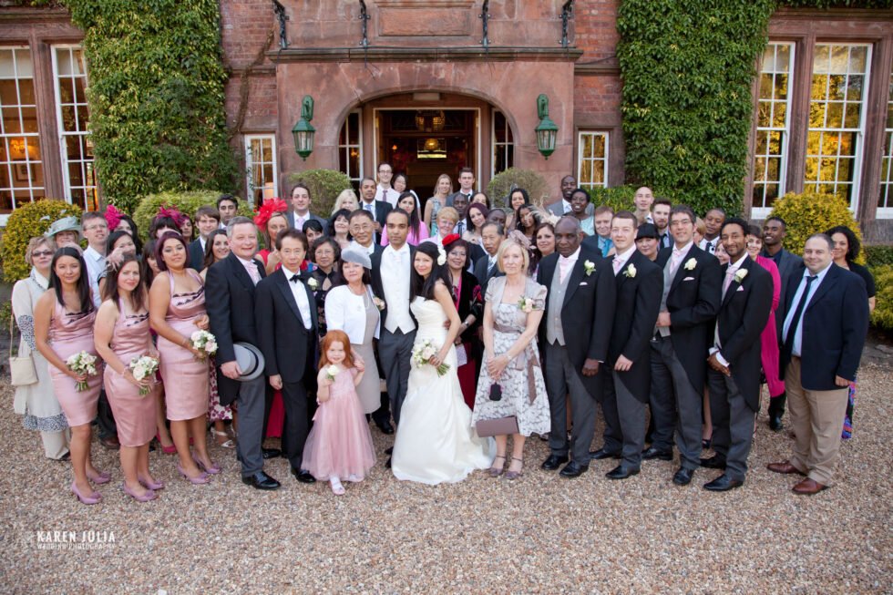 a group photo at an Alice in Wonderland themed wedding