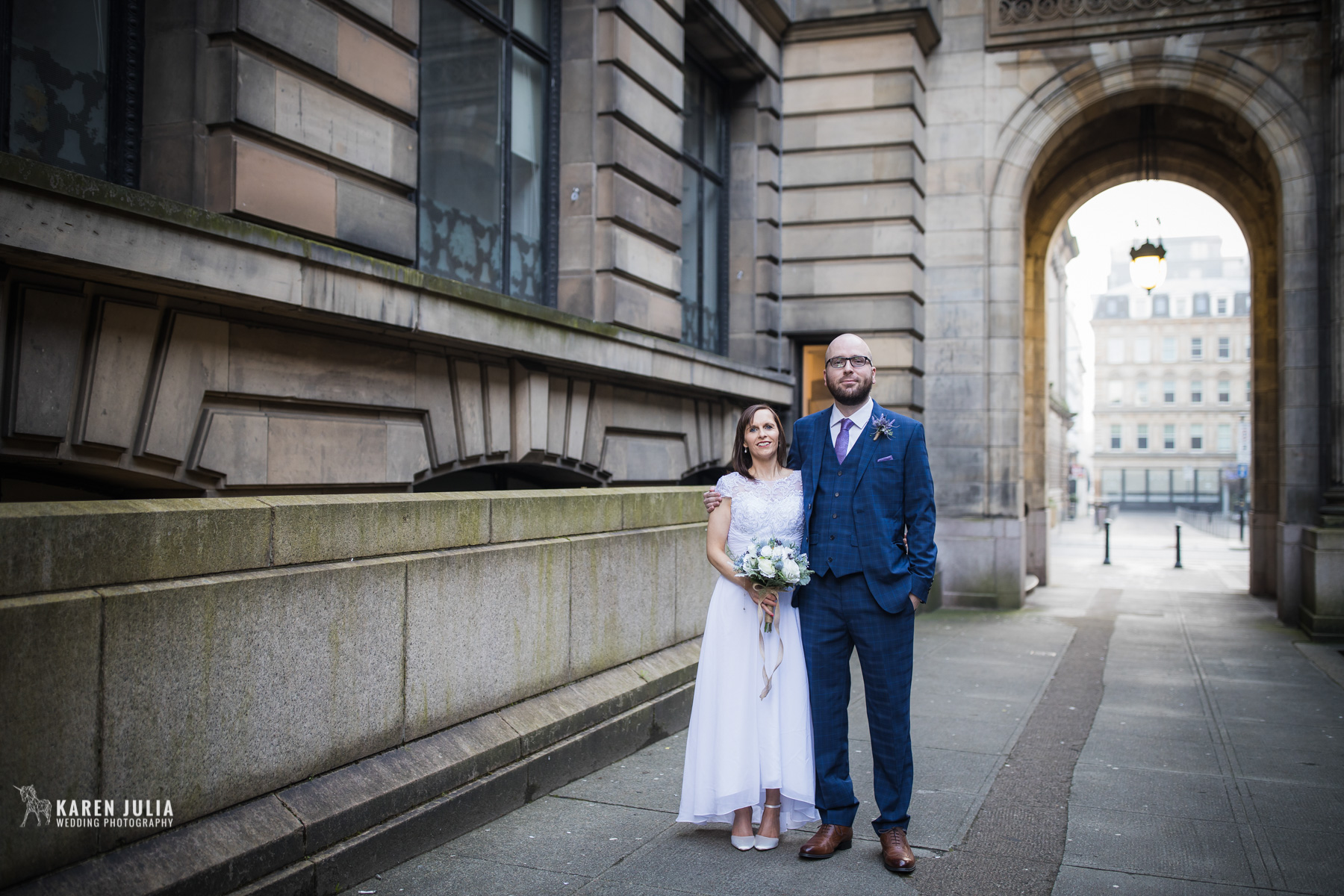 bride and groom pose for a wedding portrait in John Street, around the corner from 23 Montrose Street