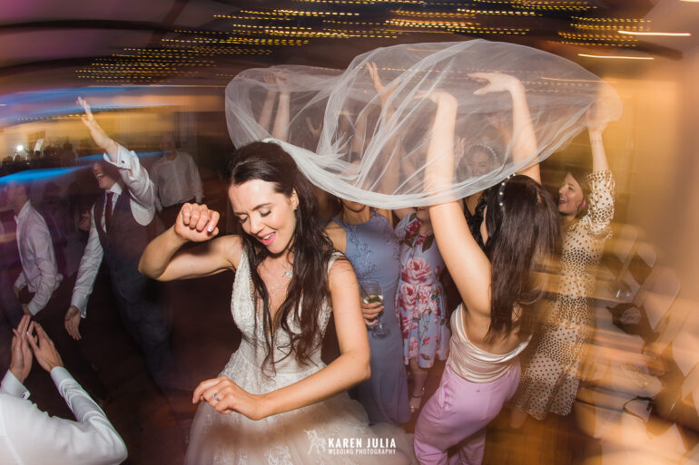 bride on dancefloor during evening wedding reception