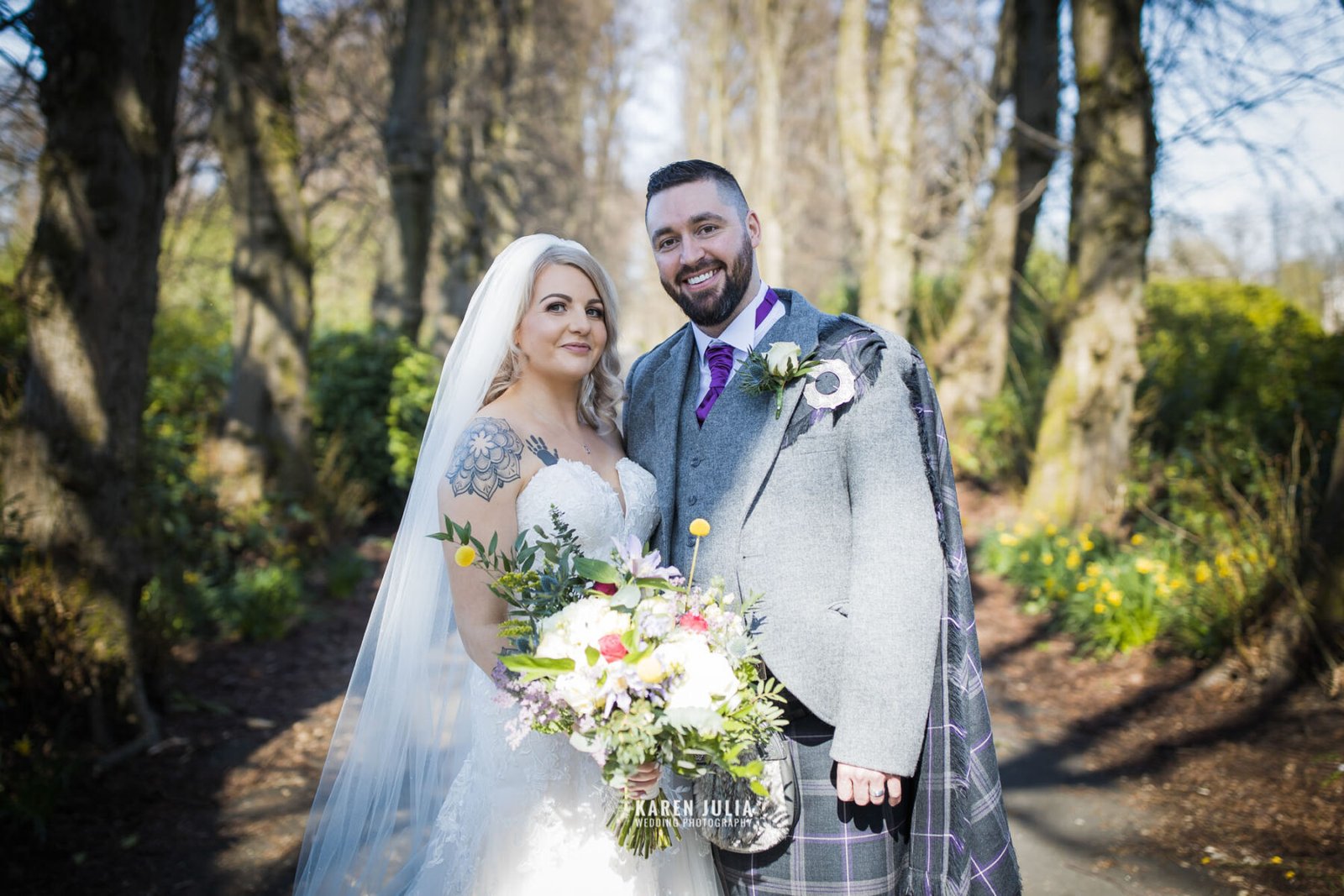 bride and groom having a portrait in Maxwell Park as part of their Pollokshields burgh hall wedding photos