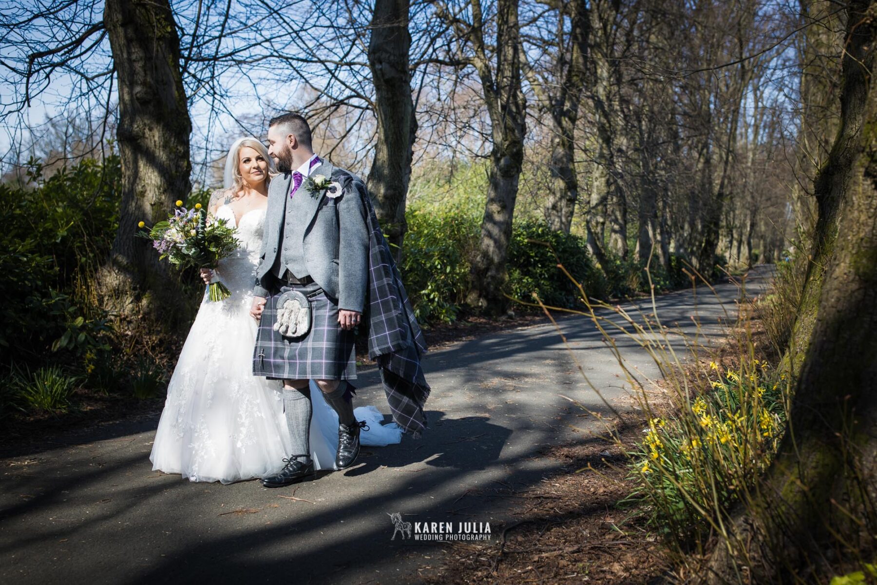 bride and groom walk together in Maxwell Park during their Pollokshields Burgh Hall Wedding Photos