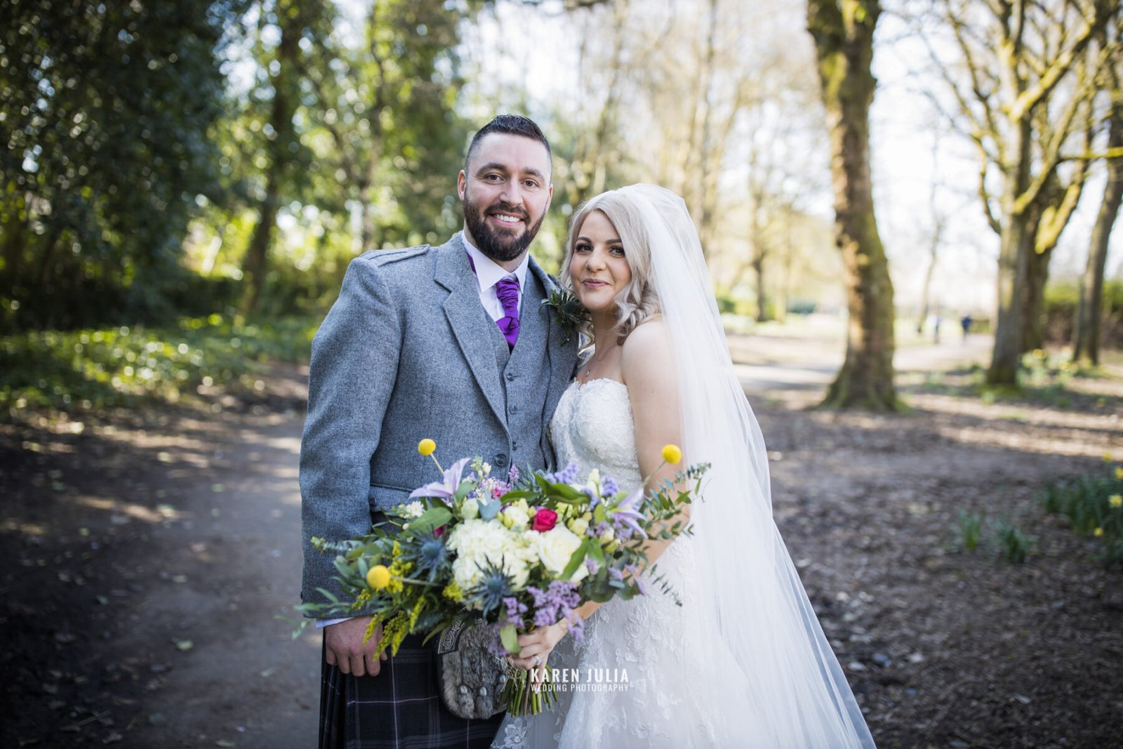 bride and groom pose for a portrait on their wedding day in Maxwell Park