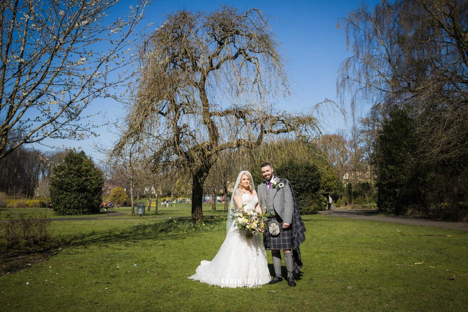 bride and groom pose for a portrait together as part of their Pollokshields Burgh Hall Wedding Photos