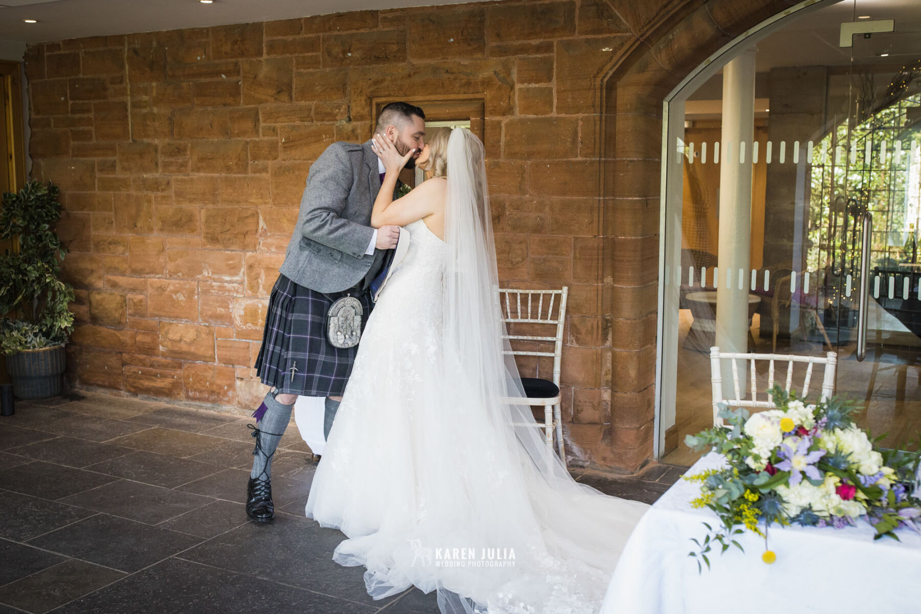 bride and groom kiss during ceremony at Pollokshields Burgh Hall Wedding 