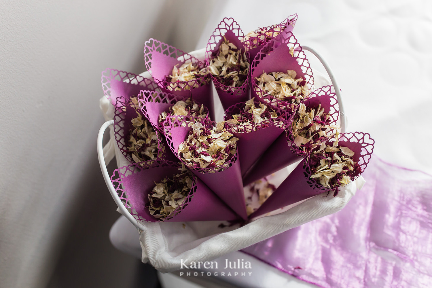 handmade burgundy confetti cones holding dried flower confetti
