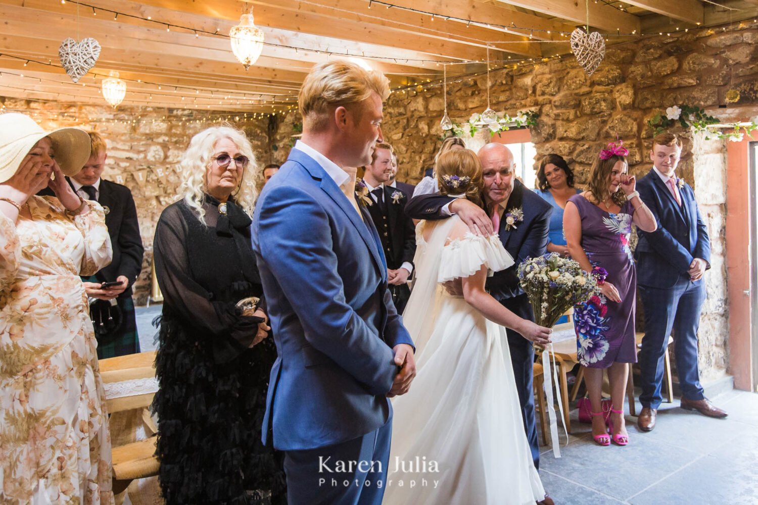 bride hugs her Dad in the barn at Fruin Farm