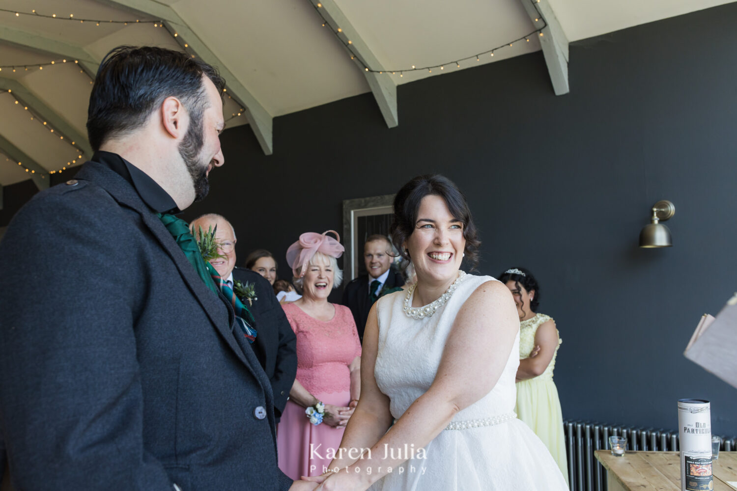 bride smiles after rings have been exchanged in Fruin Farm