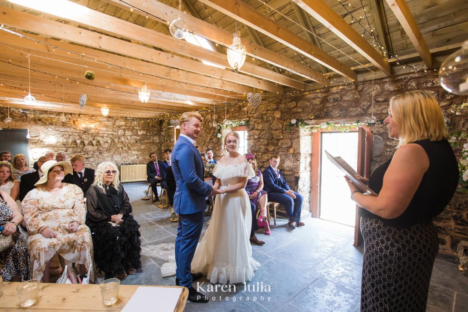 officiant addresses guests during wedding ceremony