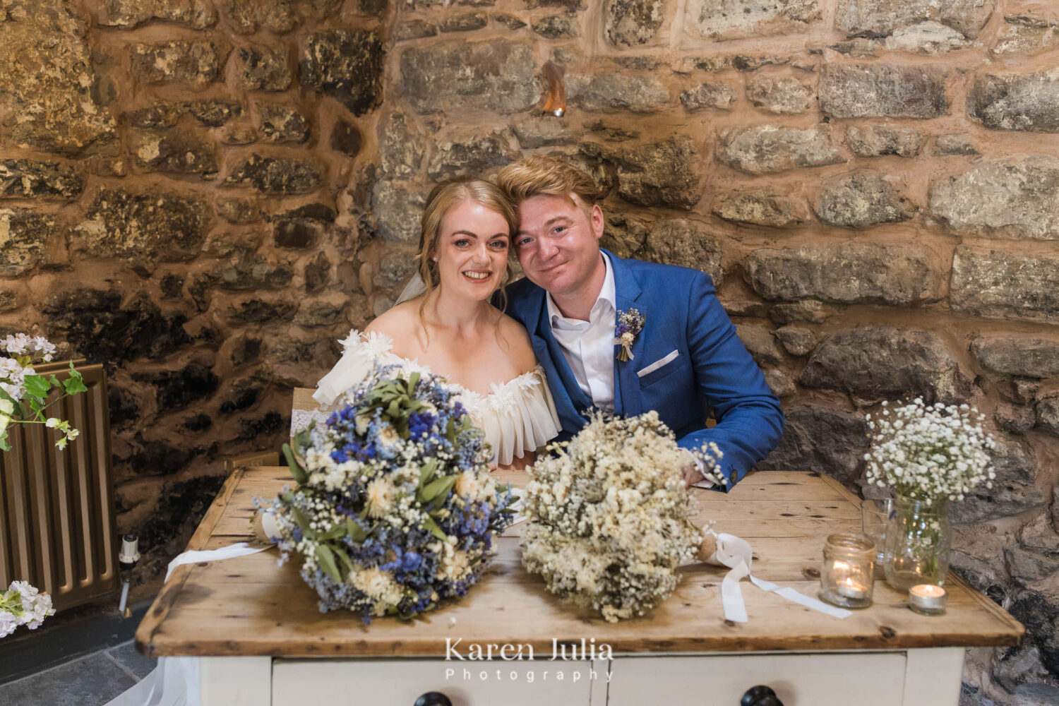 bride and groom pose for a portrait with the wedding register at Fruin Farm