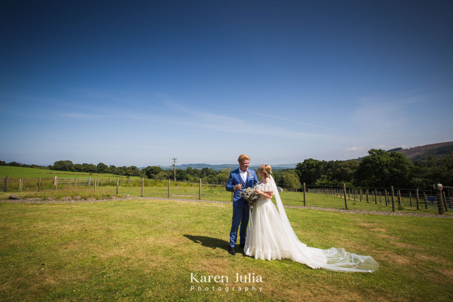 bride and groom wedding day portrait at Fruin Farm, with Loch Lomond in the background