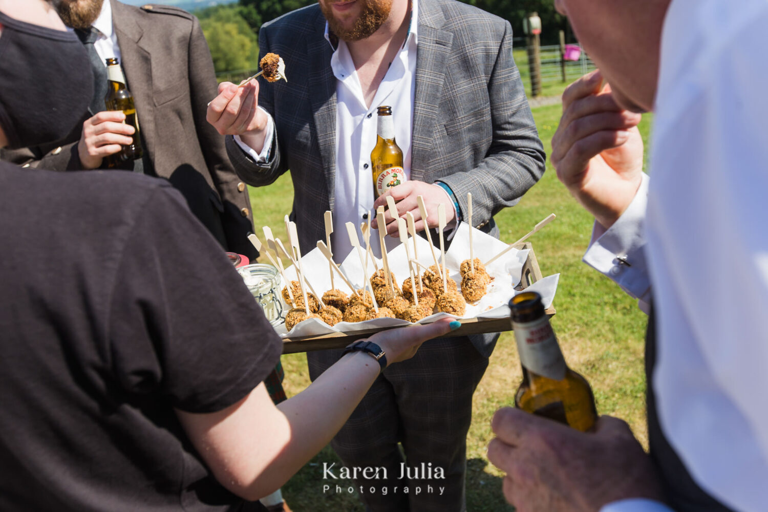 staff bring canapes for guests to ejoy during the dinks reception
