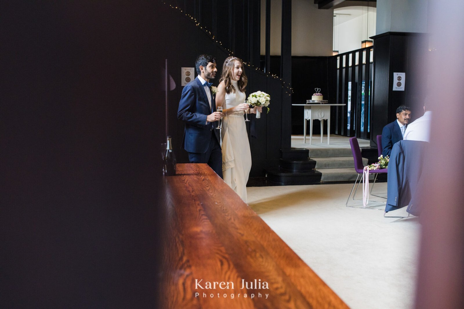 bride and groom enter their drinks reception together