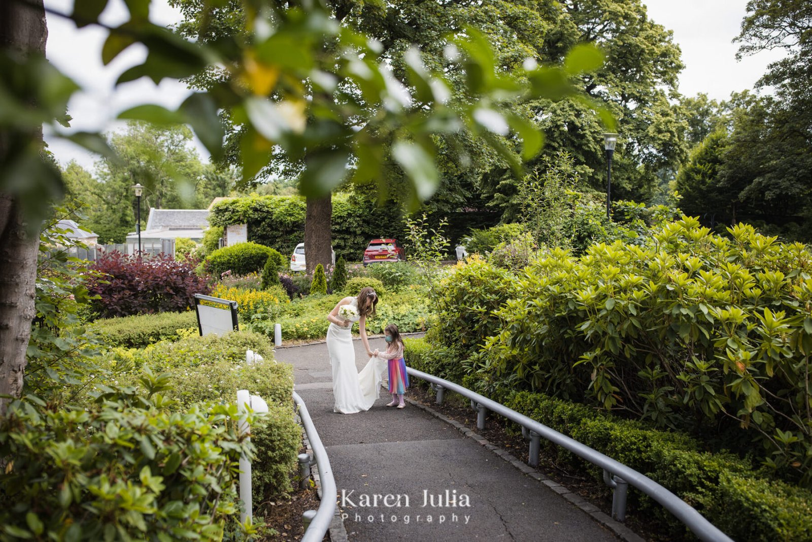 bride and bridesmaid walking to the venue