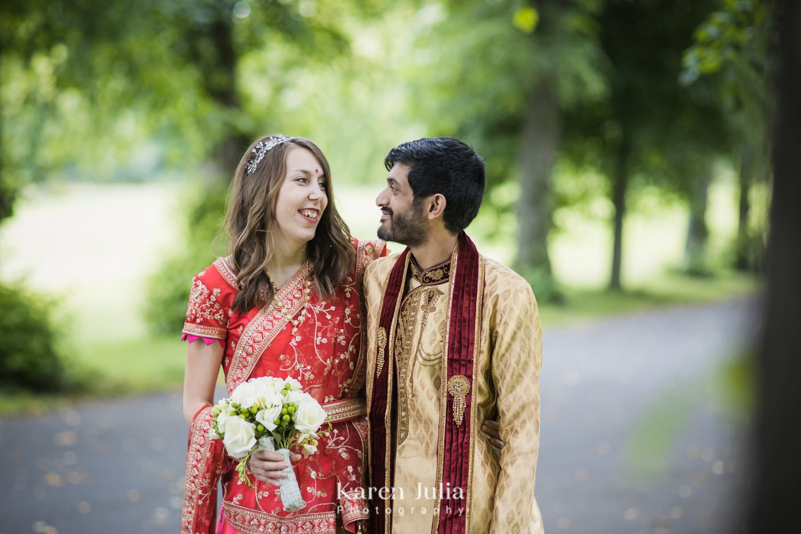 bride and groom pose for a wedding portrait in Bellahouston Park