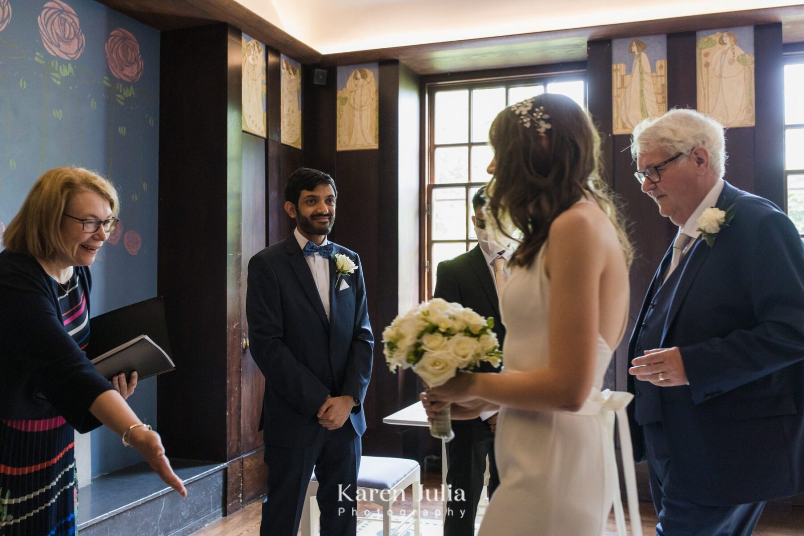 bride arrive at wedding ceremony as the groom sees her for the first time in her dress