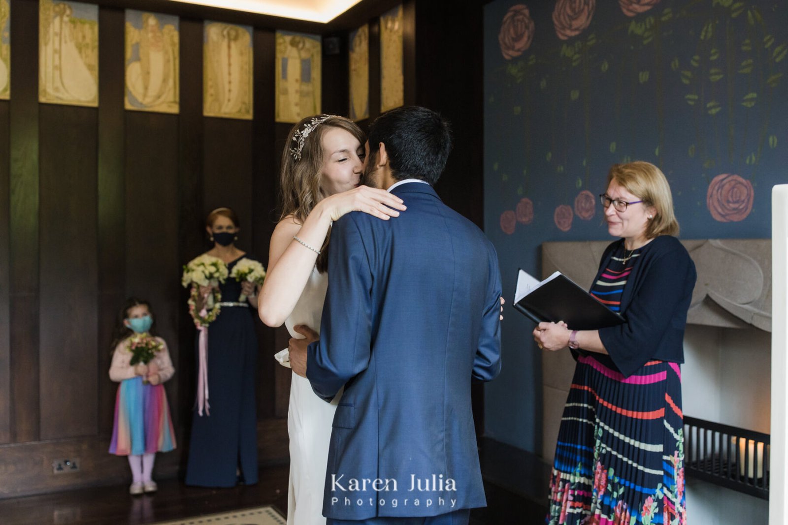 bride and groom kiss at the end of the wedding ceremony