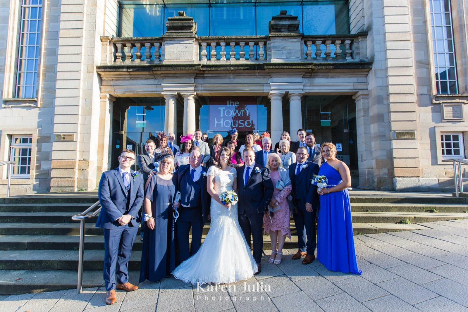 group photo of wedding guests outside The Town House, Hamilton