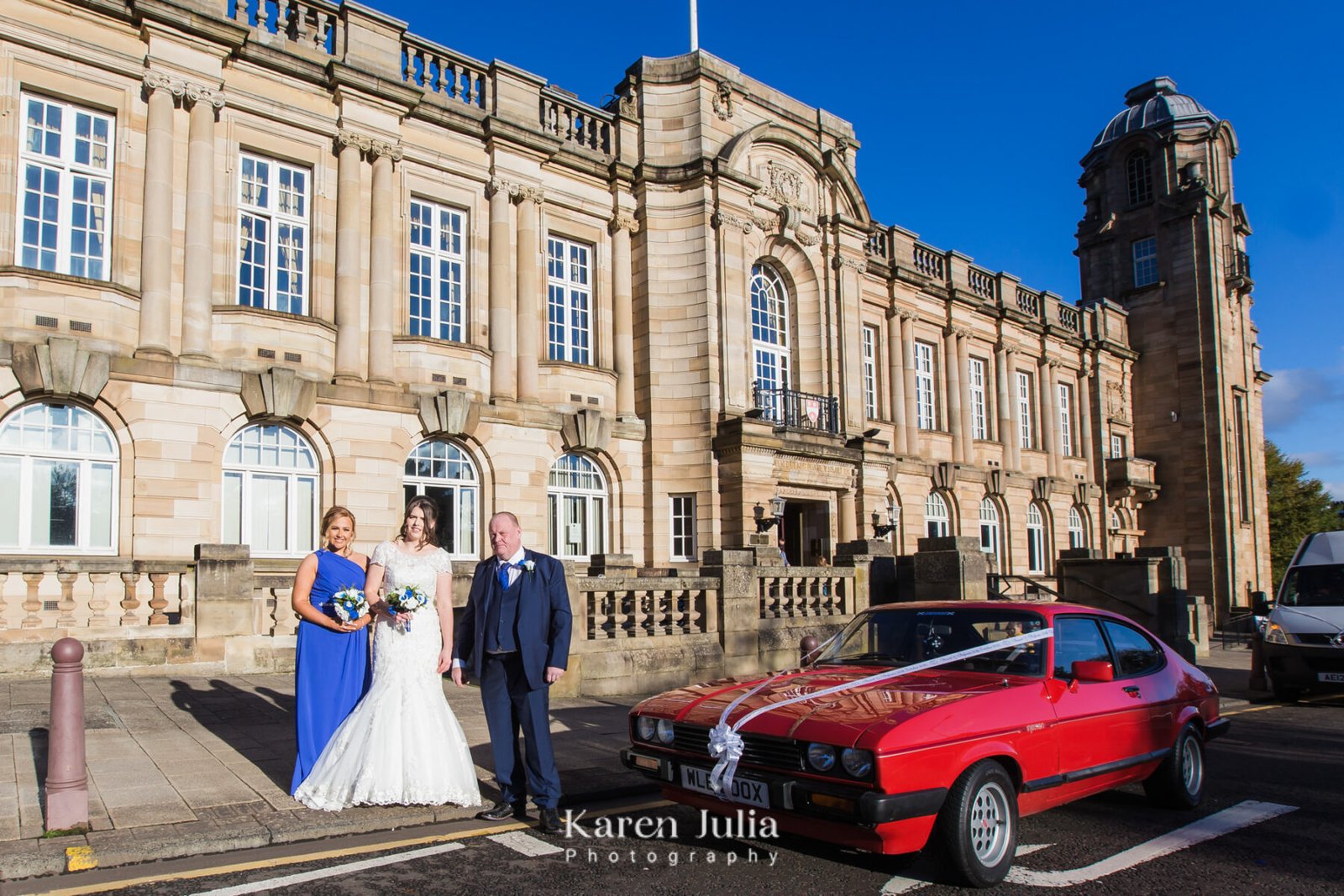 bride stands with her dad and bridesmaid outside The Town House, Hamilton