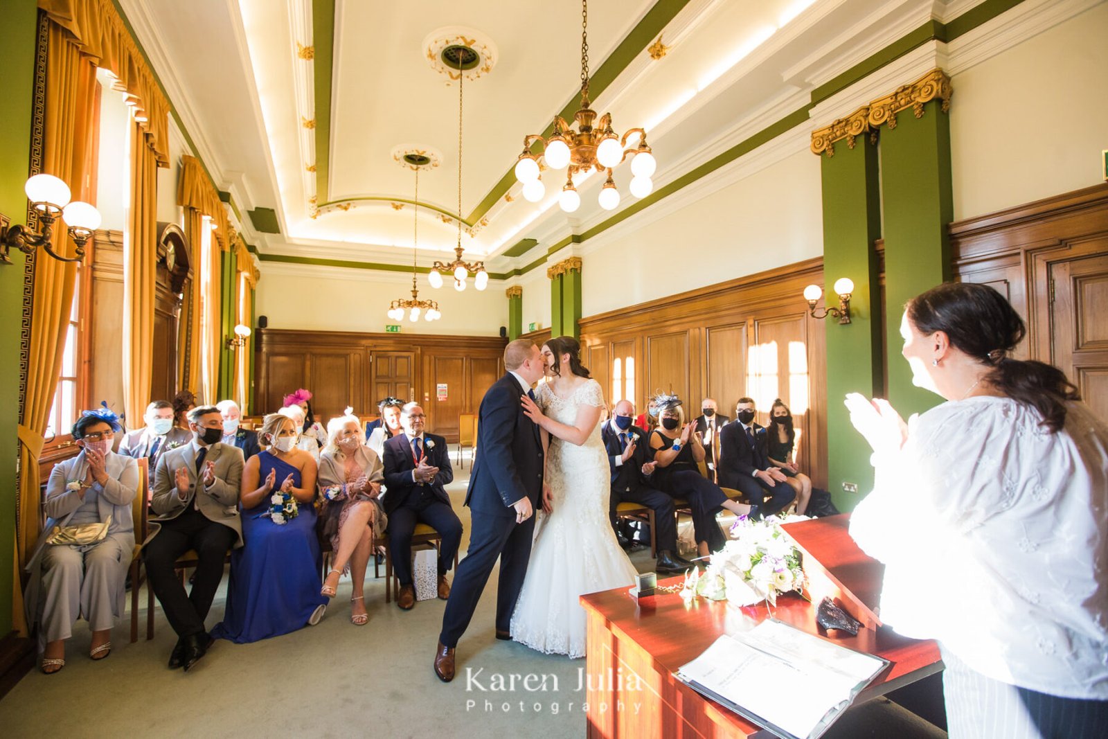 bride and groom kiss at the end of the wedding ceremony