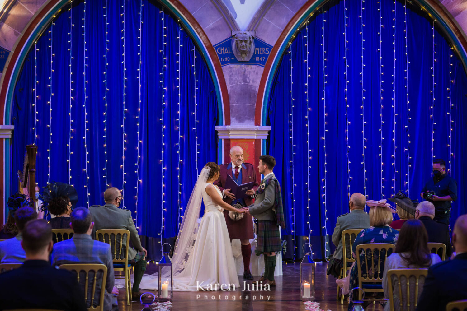 bride and groom exchange vows at their wedding ceremony at Oran Mor