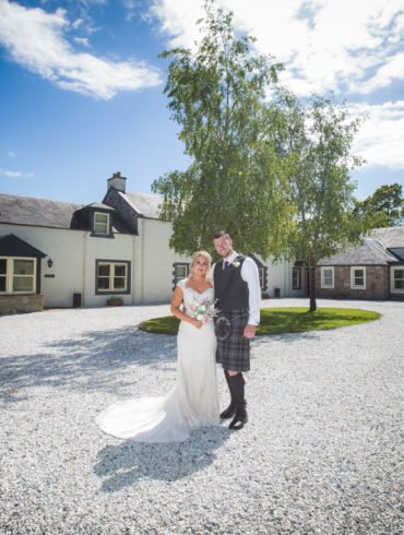 bride and groom in the courtyard of Barwheys