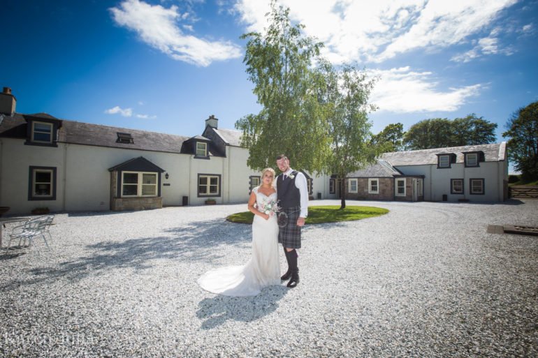 bride and groom in the courtyard of Barwheys