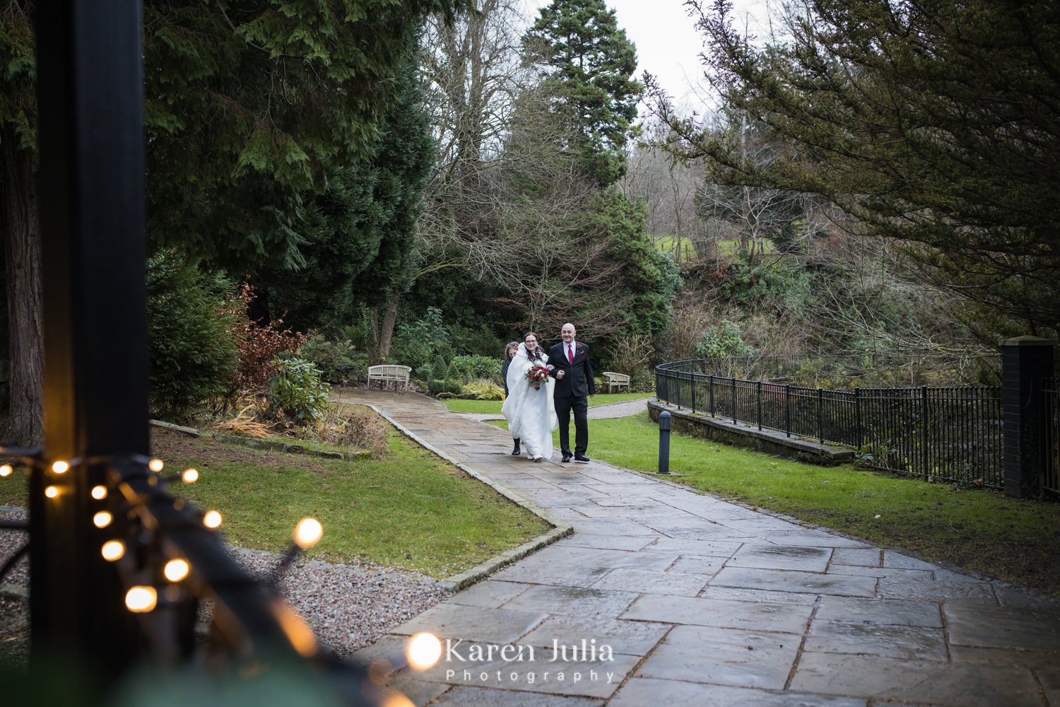 bride walks to ceremony area with her dad