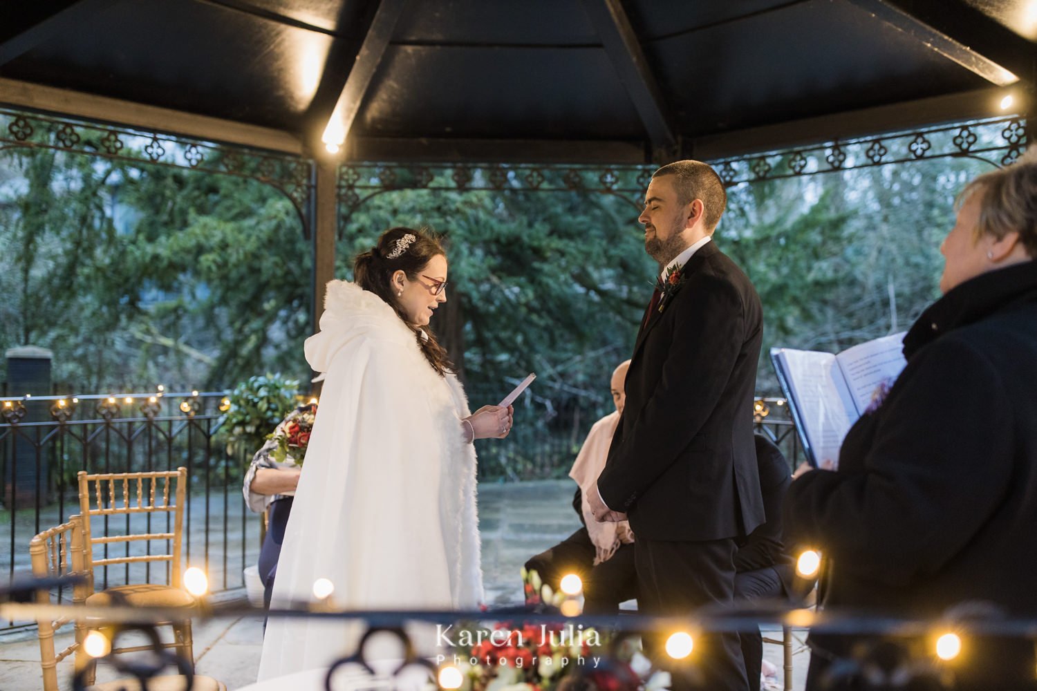 bride reads vows to groom during wedding ceremony