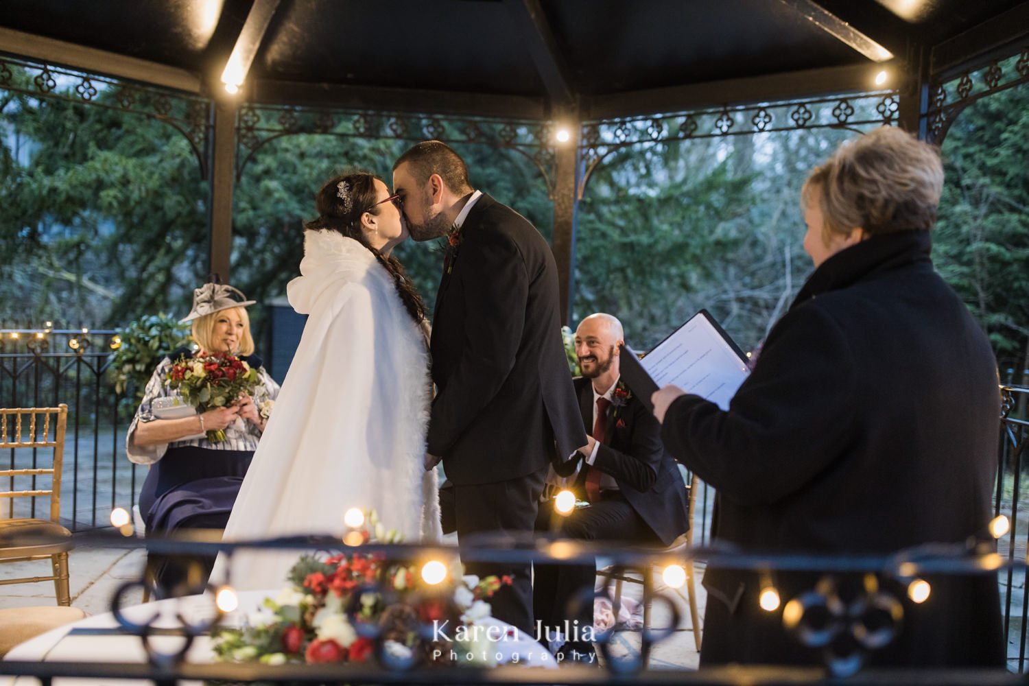 bride and groom kiss after wedding ceremoony