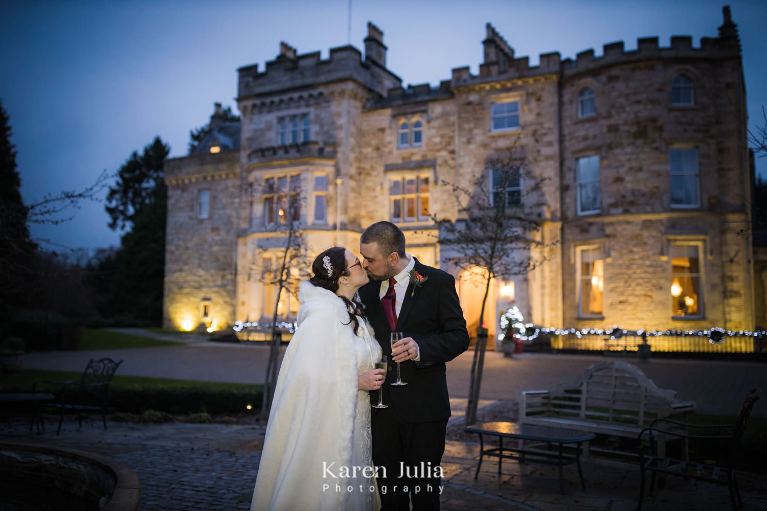 bride and groom outside Crossbasket Castle during blue hour