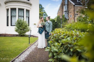 bride and groom outside Number 10 Hotel on their wedding day