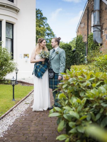 bride and groom outside Number 10 Hotel on their wedding day