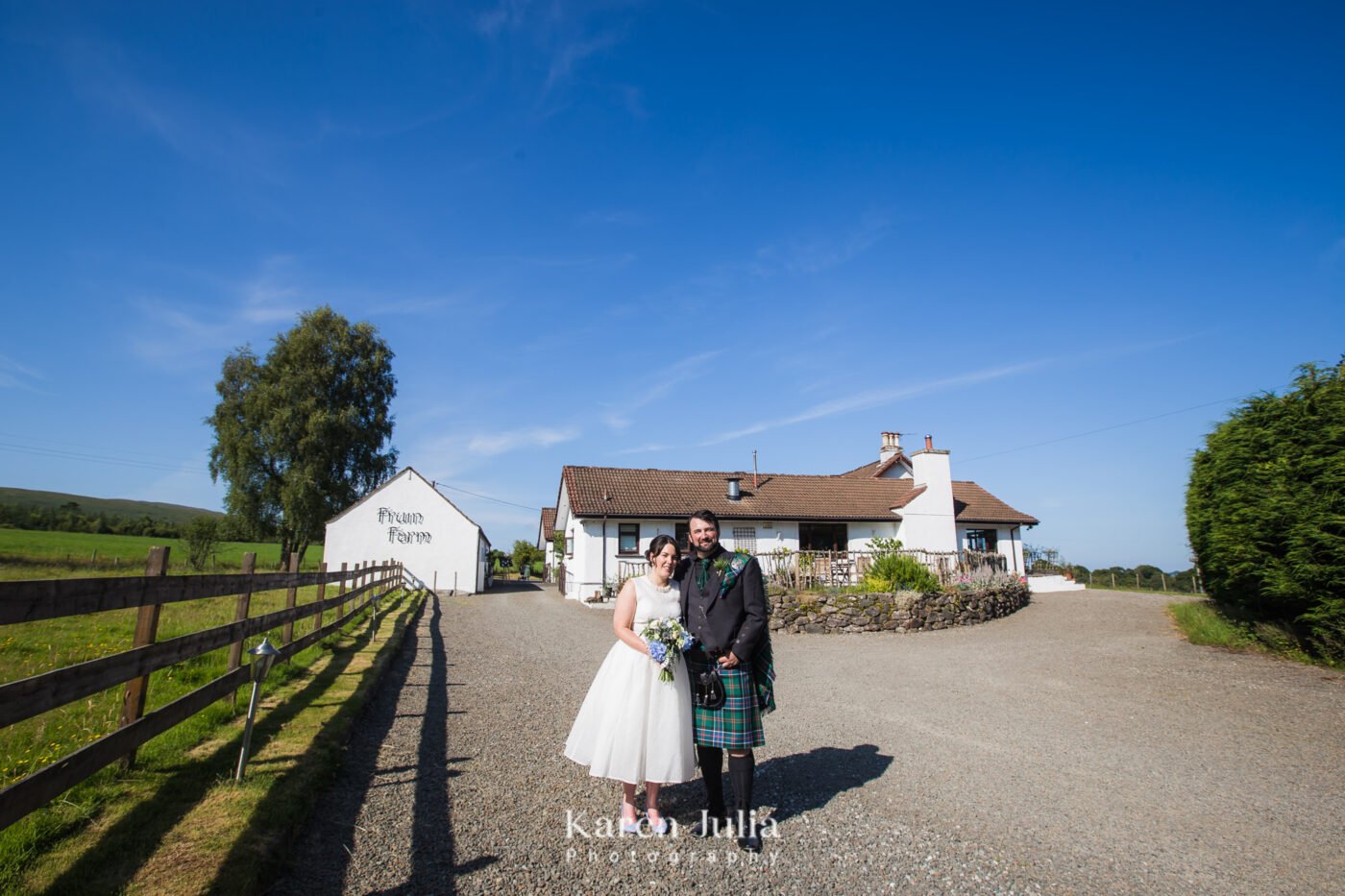 bride and groom wedding day portrait with Fruin Farm in the background