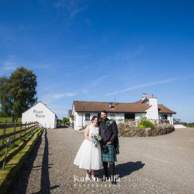bride and groom wedding day portrait with Fruin Farm in the background