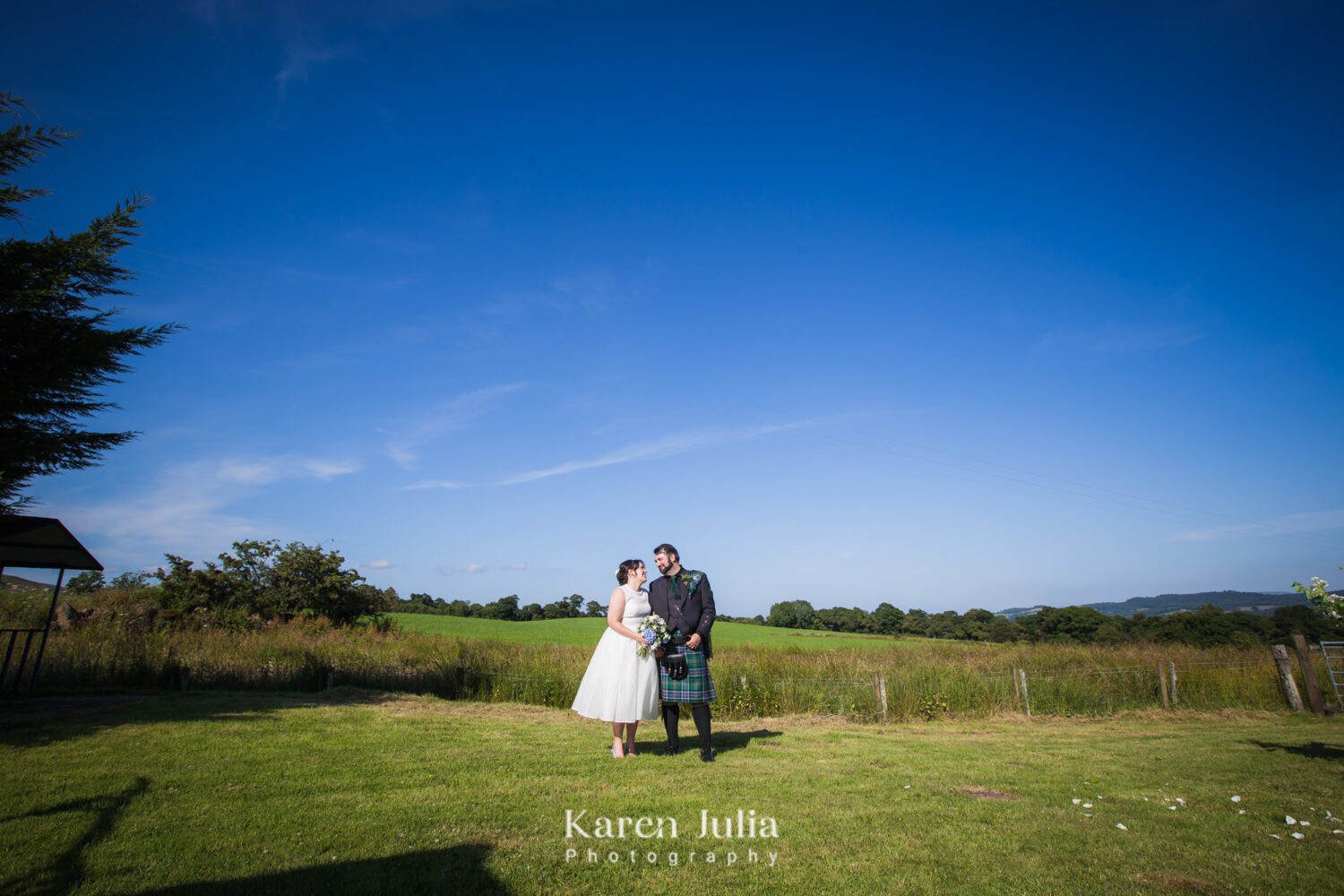bride and groom wedding portrait with a picturesque backdrop at Fruin Farm