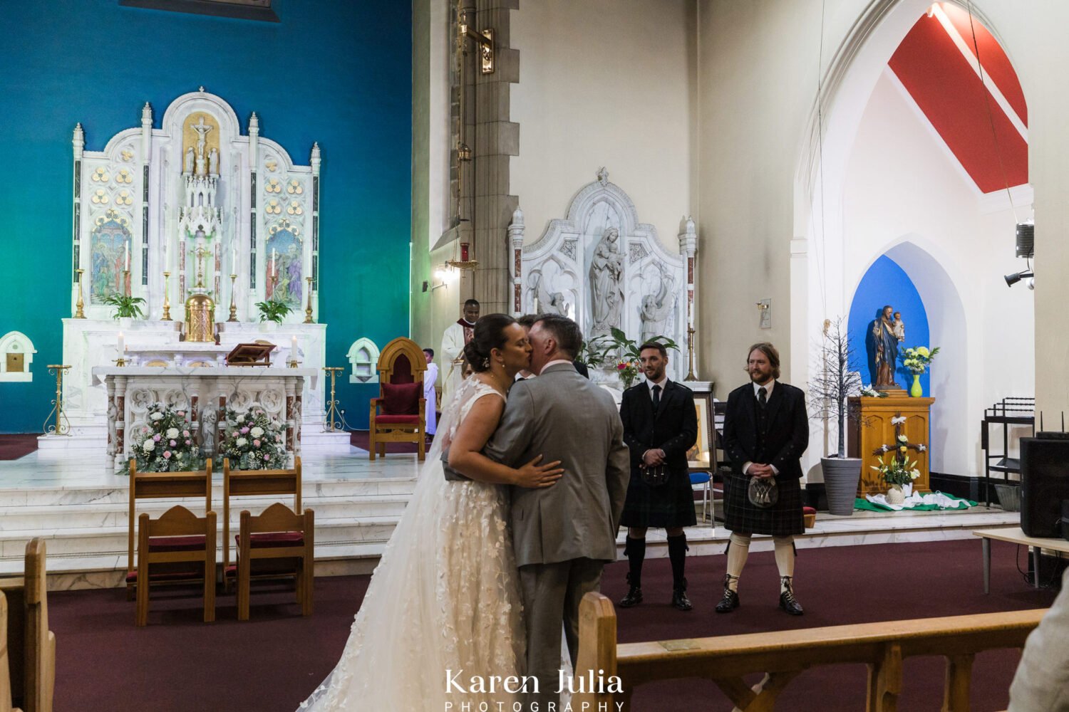 brides dad gives her a kiss and a hug before the start of the wedding ceremony