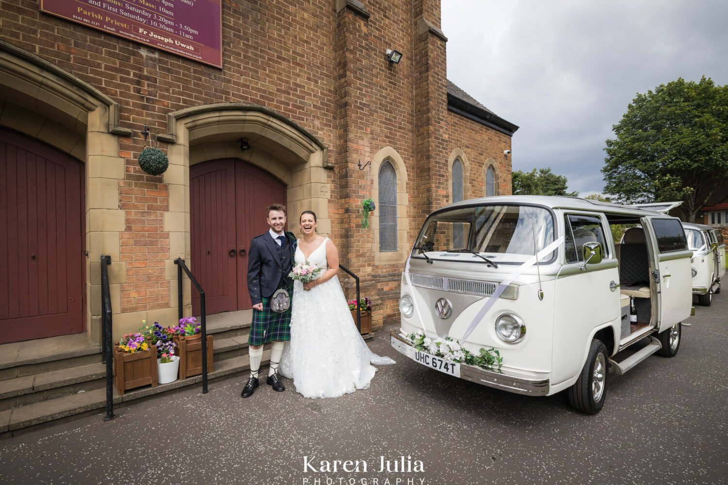 bride and groom pose for a portrait with their vintage campervan outside the church