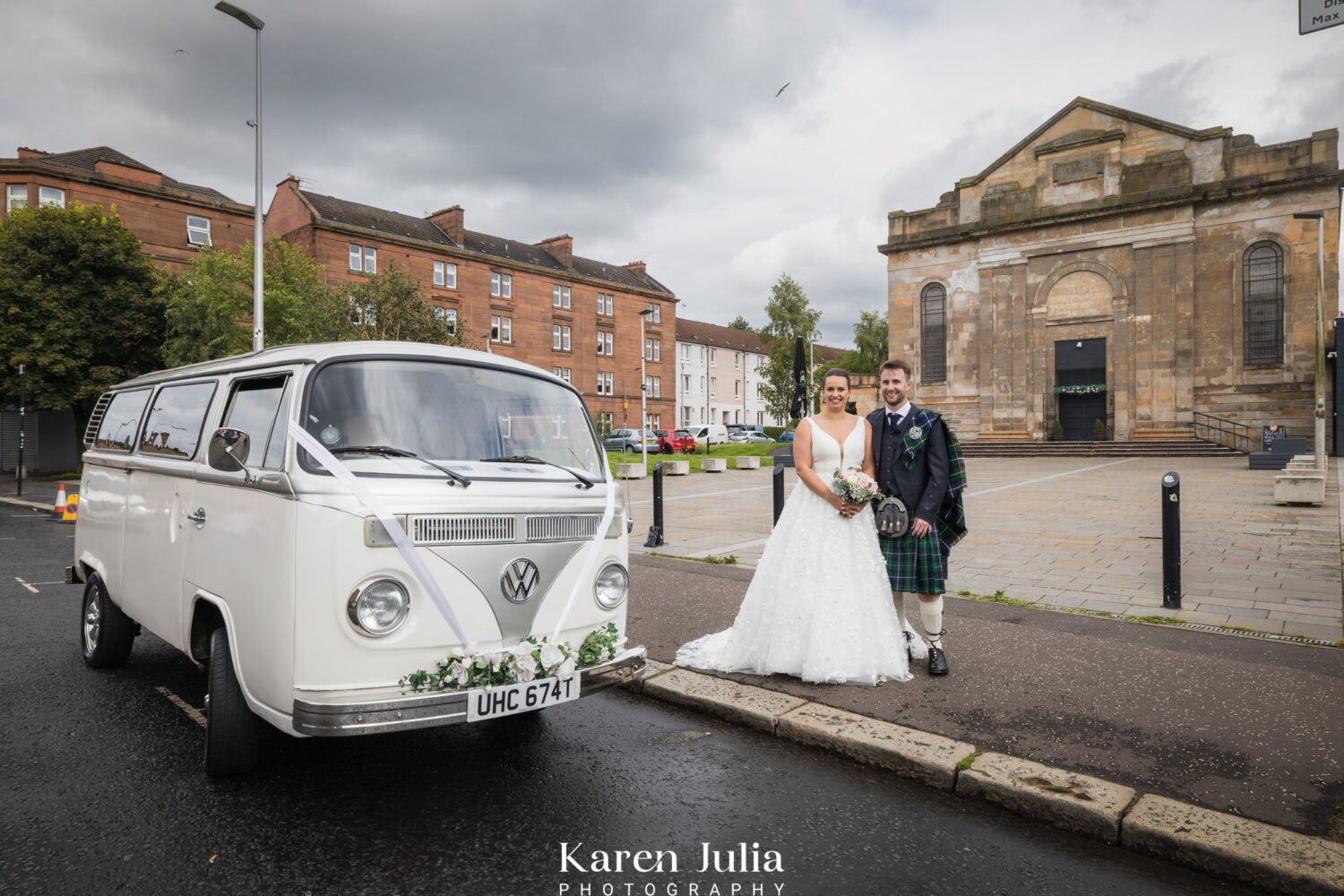 bride and groom portrait outside St Luke's and the winged ox on their wedding day