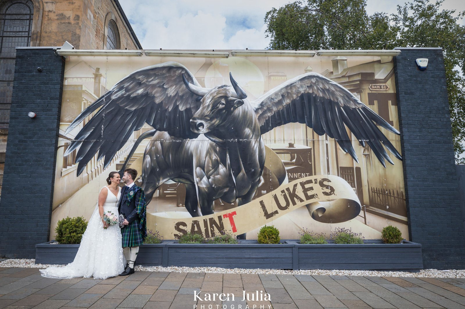 bride and groom portrait on their wedding day outside Wedding Photography at Saint Luke's & The Winged Ox