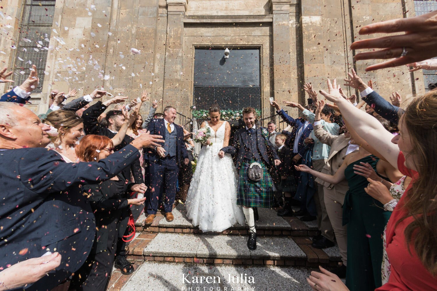 confetti throw outside Saint Lukes and the winged ox