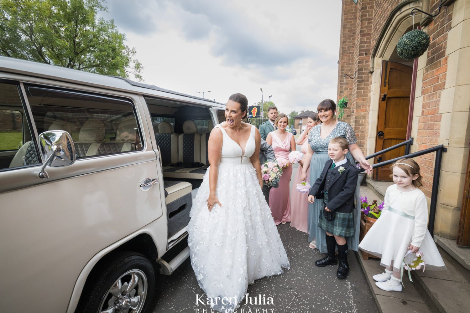 bride arrives at the church in a vintage campervan