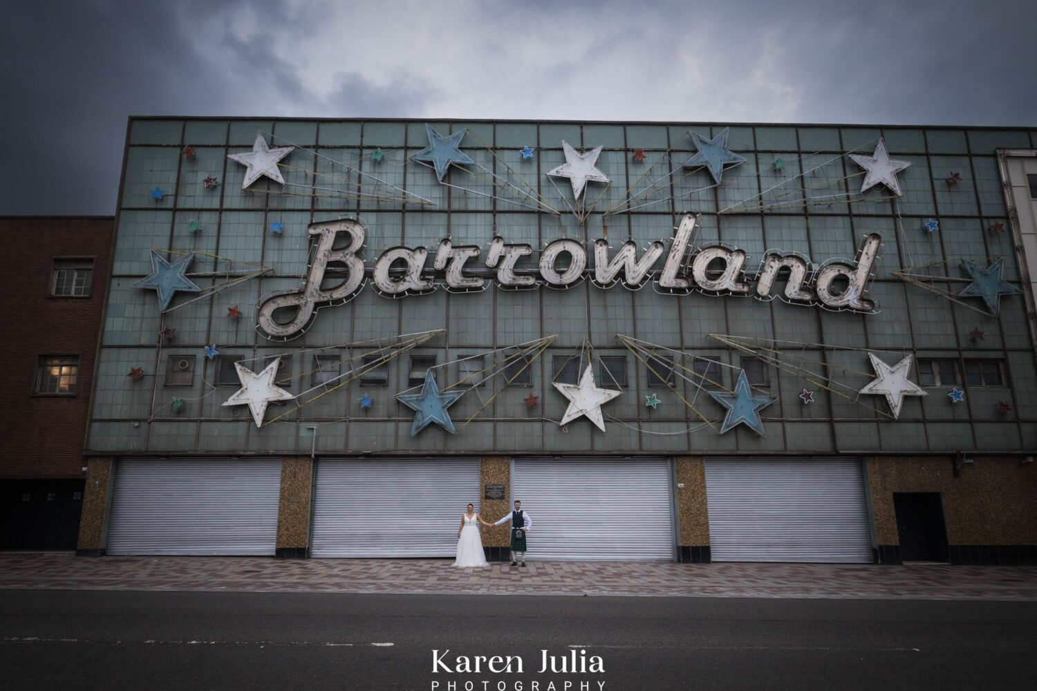 bride and groom wedding photograph in front of the famous Barrowland Ballroom sign